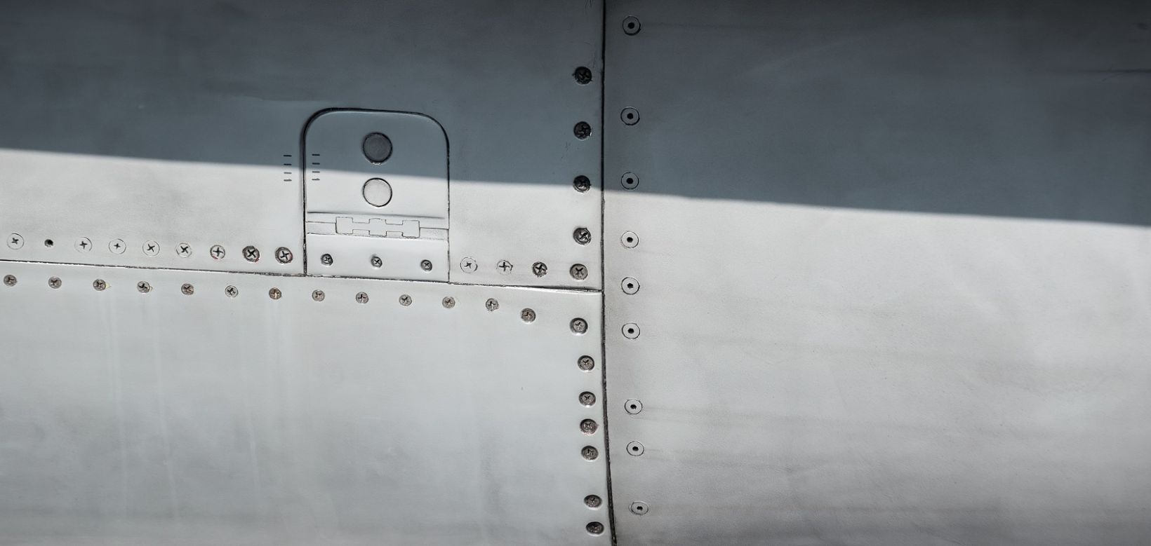 Figure 1. Inpection of fastener holes on an aircraft using a MiniMite™ rotating bolthole scanner and NORTEC™ series eddy current flaw detector.