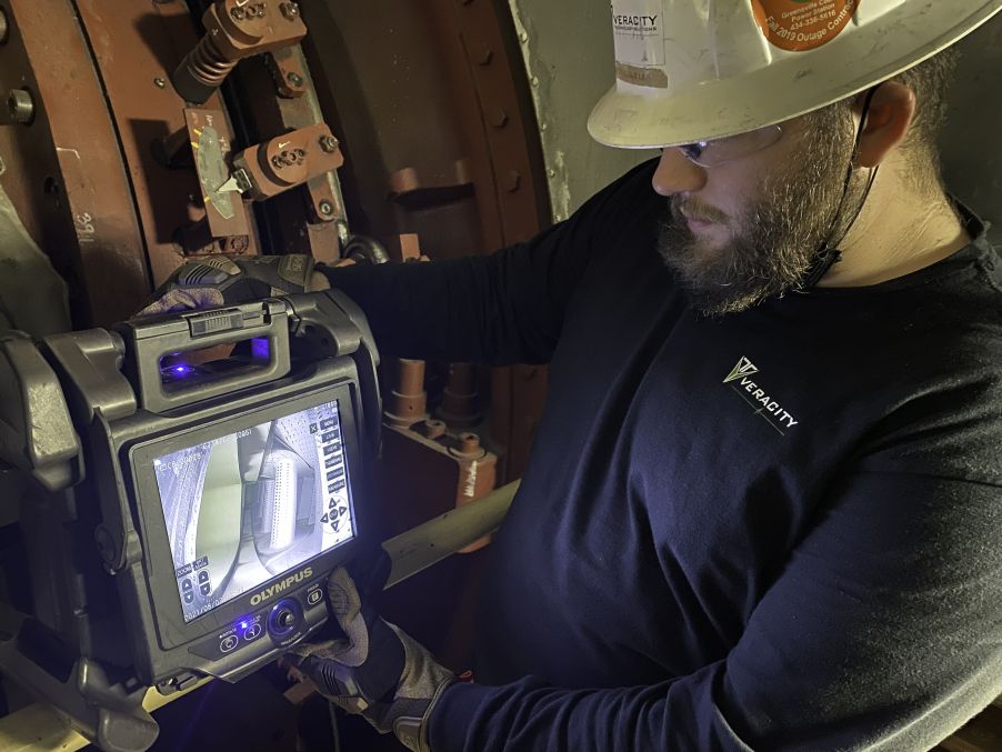 Veracity Technology Solutions inspector using Olympus’ IPLEX NX videoscope to perform a remote visual inspection of a gas turbine in a power plant