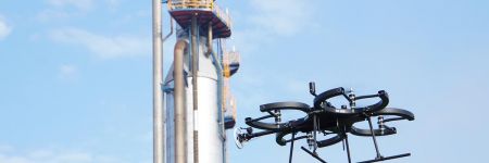 Skygauge inspection drone hovering by storage tanks